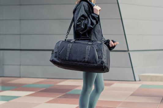 MONARC DUFFEL BACKPACK BEING USED FOR TRAVEL AND AS A GYM BAG