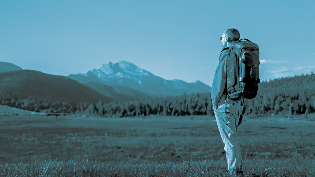 Man standing with Monarc Travel Duffel Backpack