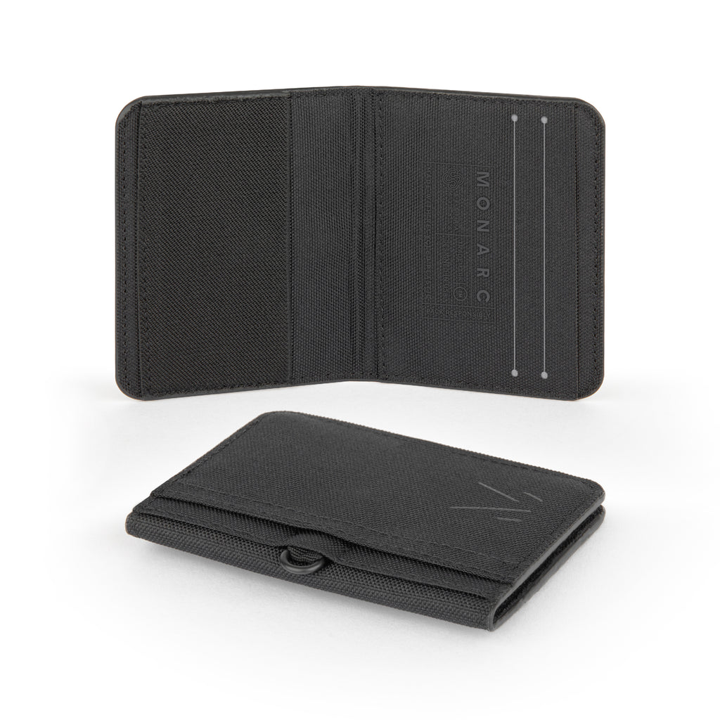 Open and folded views of Monarc's sleek black wallet, highlighting its minimalist design. The wallet features multiple compartments for cards and a secure closure, all crafted from durable recycled materials with detailed stitching and embossed Monarc branding.