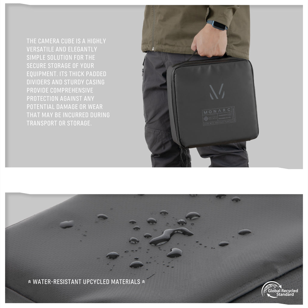 "Monarc Camera Cube showcased by a person, highlighting its portable and sturdy design ideal for on-the-go photographers. The cube is constructed from water-resistant upcycled materials, ensuring durable protection against damage during transport or storage, with a sleek black finish and visible Monarc logo.