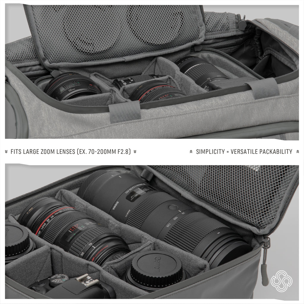 Interior of the Monarc Camera Cube in gray, strategically loaded with large zoom lenses such as the 70-200mm F2.8, showcasing its capacity and versatile packability. The cube features adjustable padded dividers to secure and organize the lenses neatly, emphasizing simplicity and efficient use of space.