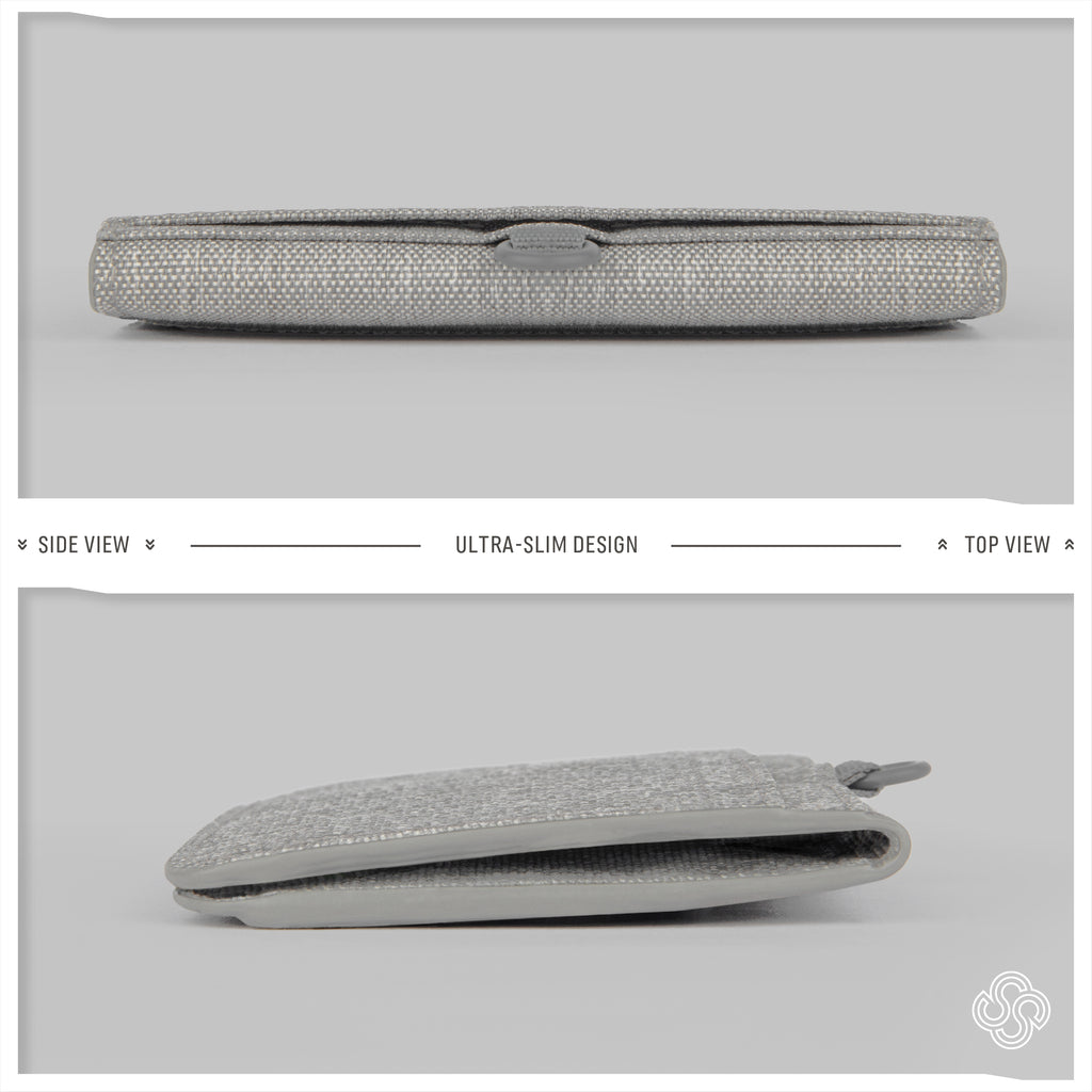 Profile and top views of the Monarc wallet in gray, demonstrating its ultra-slim design. The minimalistic and sleek wallet is displayed closed and slightly open, highlighting its thinness and the subtle Monarc logo on the closure.